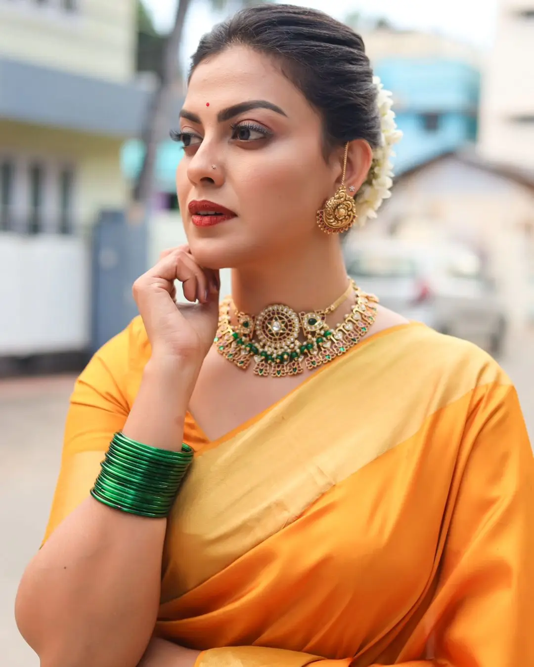 Anusree Nair Wearing Beautiful Earrings Jewellery Orange Saree Blouse